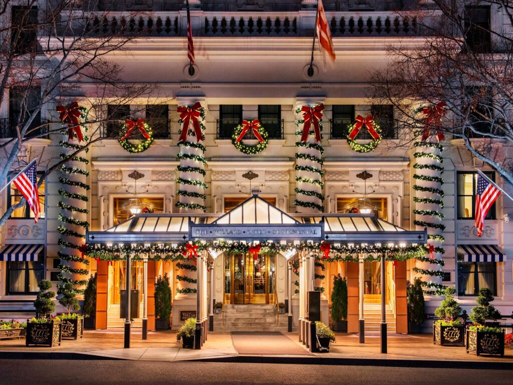 Exterior of Willard Intercontinental, one of the best Washington DC hotels, with holiday decorations adorning the front