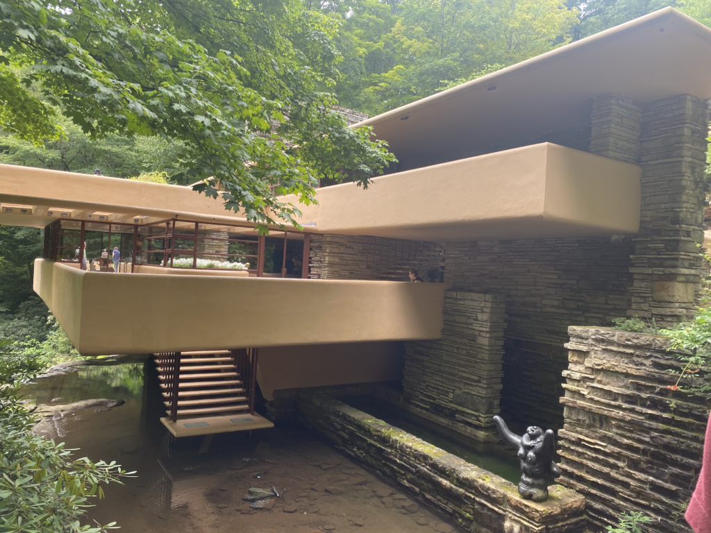 Exterior of architectural house in the woods above water
